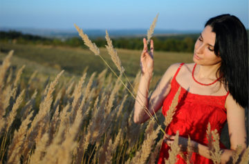 Developing intuition and psychic abilities, girl in nature in red dress, intuguide.com